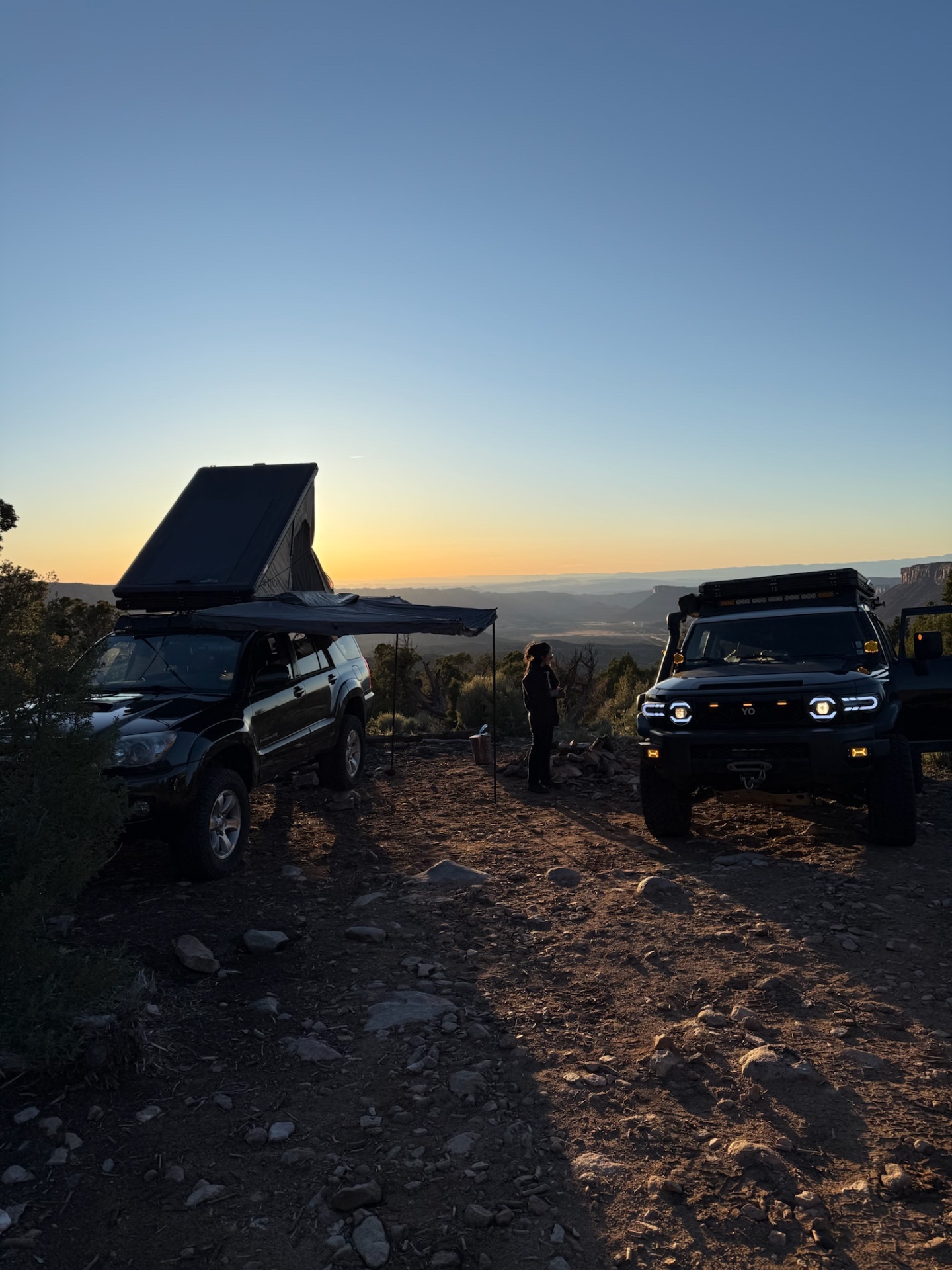 Rooftop tent camp at dusk over a Utah valley